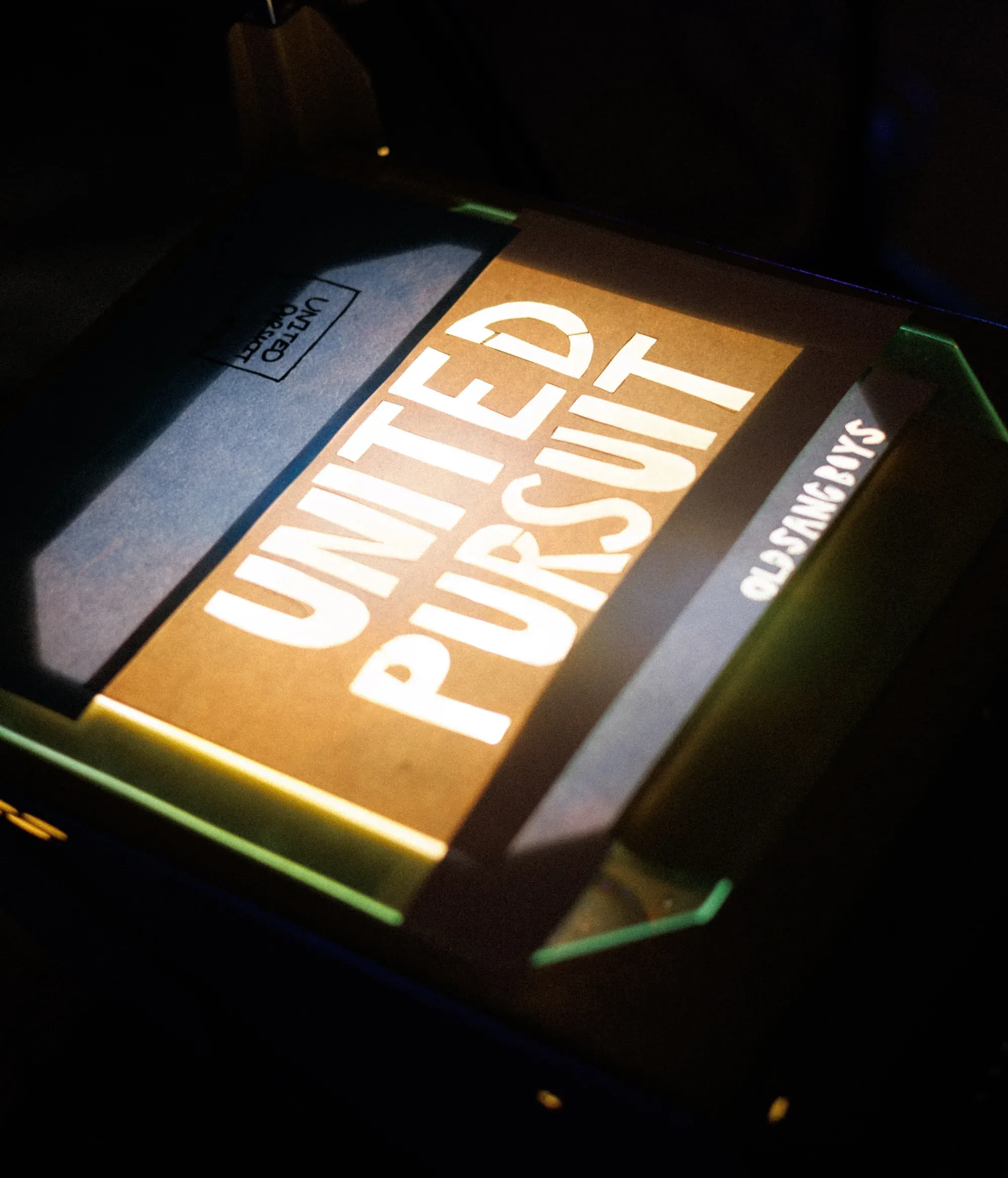 Projector with United Pursuit on it.